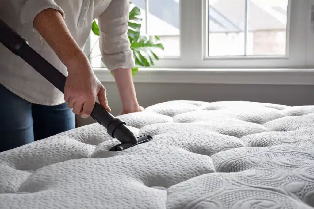 cleaning mattress with a vacuum cleaner at home 2026 03 24 08 35 55 utc