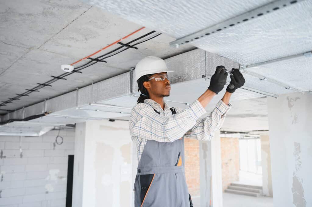 construction worker installing ventilation system 2026 01 09 11 55 47 utc