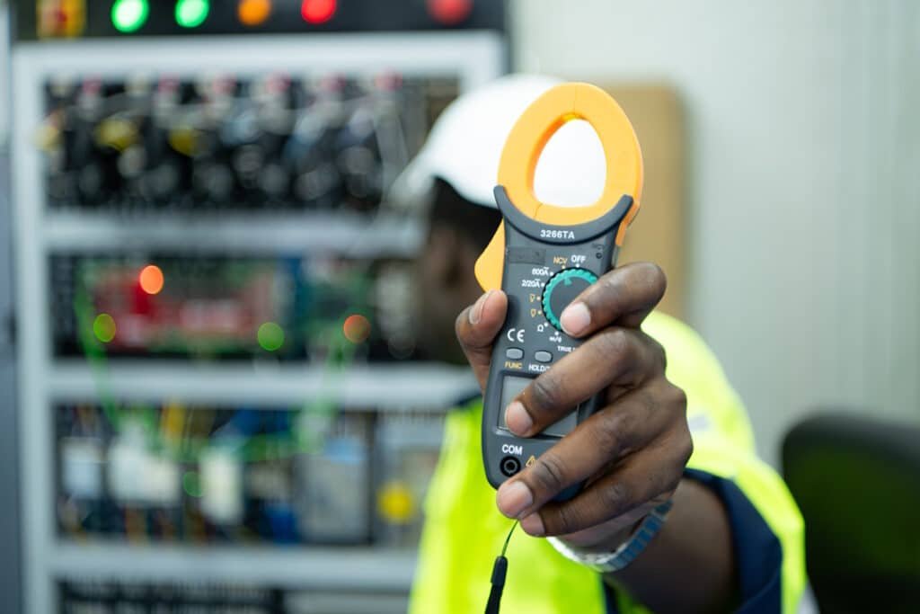 electrical professional working with voltmeter at 2026 03 17 00 01 57 utc