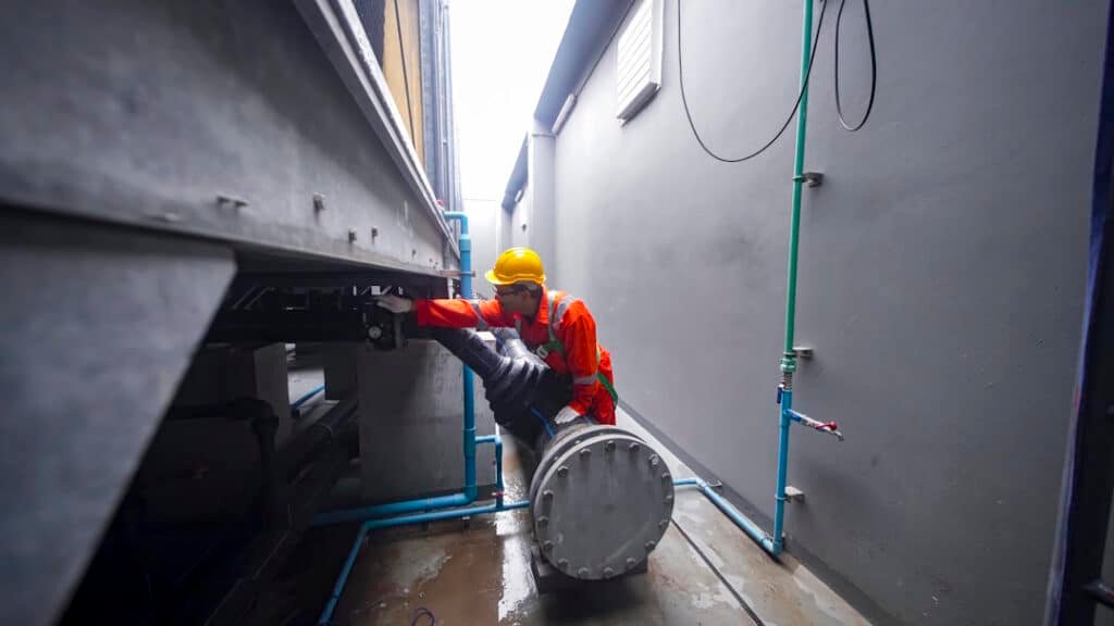 engineer inspecting industrial pipes in an urban s 2026 01 09 10 12 47 utc