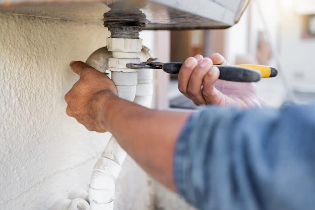 hands plumber and wrench for pipe maintenance an 2026 03 25 05 46 51 utc