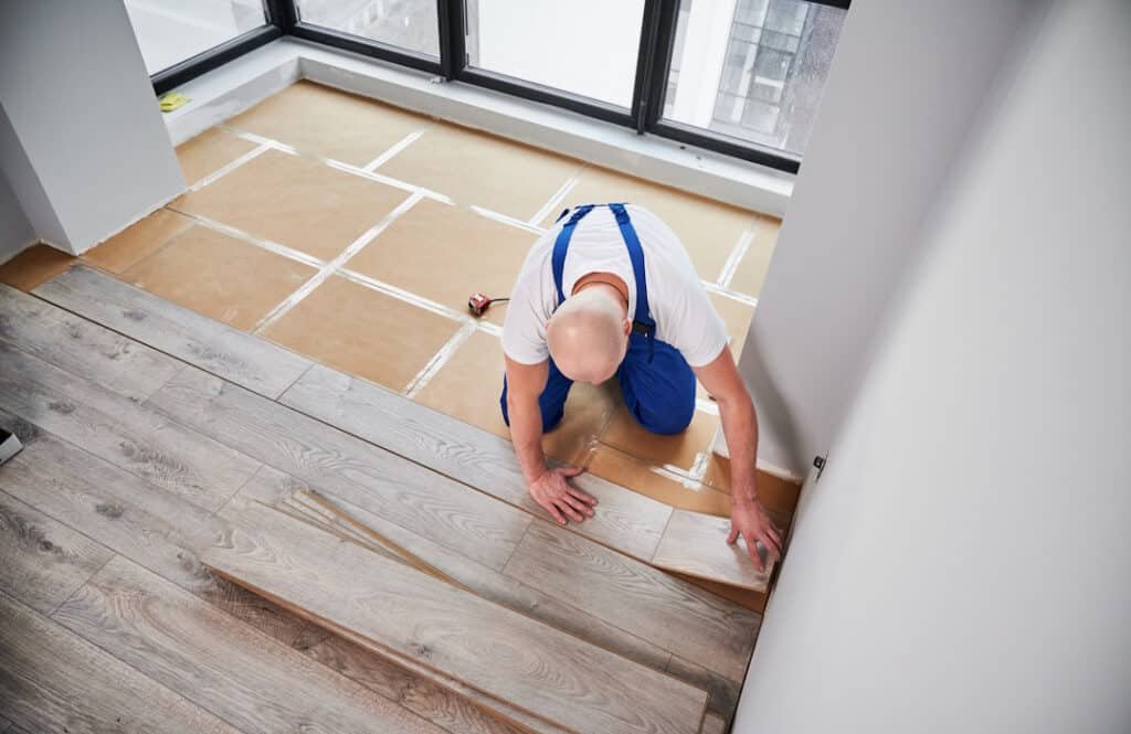 man installing wood flooring in modern home 2026 03 17 01 39 49 utc
