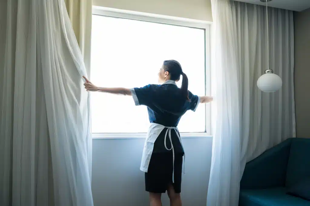 mid adult attendant working in hotel room 2026 03 25 09 18 18 utc