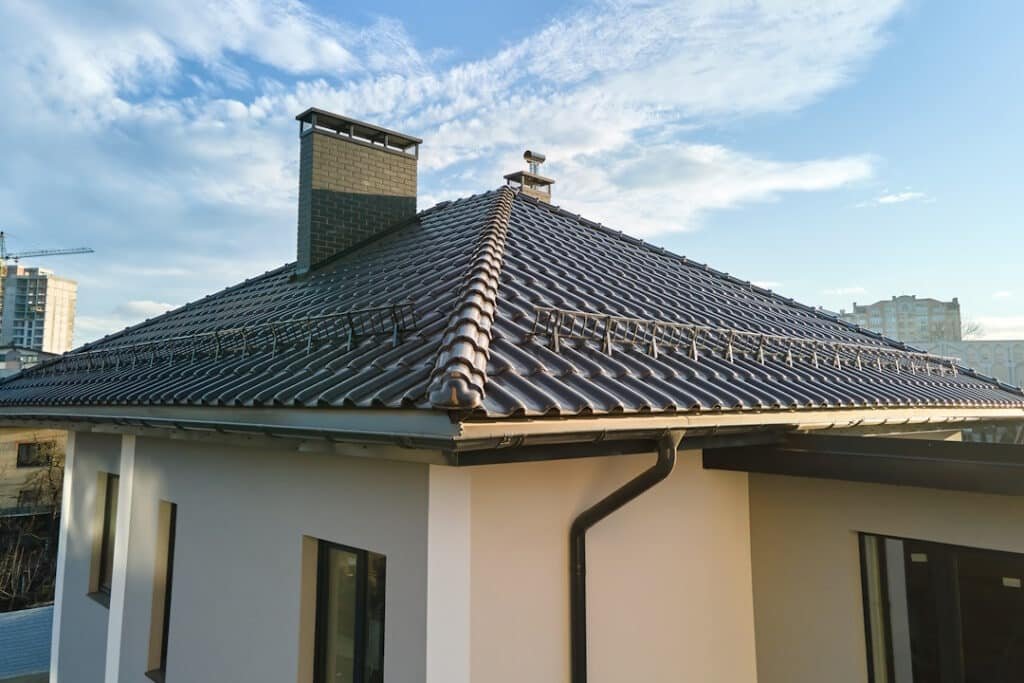 modern house with a tiled roof and chimney 2026 03 16 02 06 36 utc