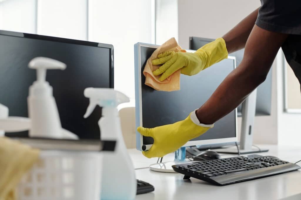 office cleaning service wiping down a computer mon 2026 03 20 04 38 30 utc