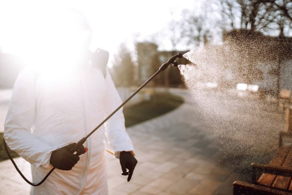spraying disinfectant outdoors during sunny weathe 2026 03 19 23 10 52 utc