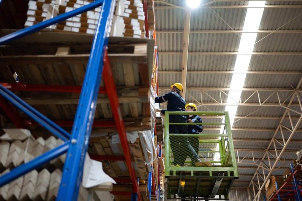 warehouse workers using forklift to check and coun 2026 03 16 04 46 36 utc