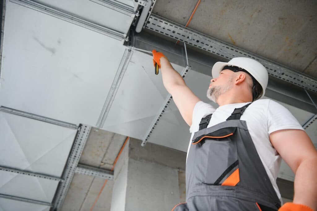 worker inspecting ventilation system in commercial 2026 03 20 04 31 22 utc